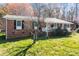 Classic brick home with black shutters and a well-maintained lawn, perfect for comfortable living at 394 Efird St, Gastonia, NC 28054