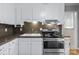 A close-up view of the sink and stove features in the compact kitchen at 394 Efird St, Gastonia, NC 28054