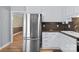 A stainless refrigerator and a partial view of the kitchen at 394 Efird St, Gastonia, NC 28054