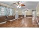 Open living room with hardwood floors, neutral paint, and multiple entryways at 394 Efird St, Gastonia, NC 28054