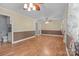 Light and airy living room with hardwood floors, ceiling fan, and neutral paint scheme at 394 Efird St, Gastonia, NC 28054