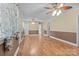 Spacious living room with hardwood floors, ceiling fans, and natural light from the windows at 394 Efird St, Gastonia, NC 28054