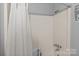 The tub and shower includes a curtain and adaptable seat at 394 Efird St, Gastonia, NC 28054