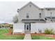 Enclosed yard with pristine white fence enhancing privacy, with walkway to the patio at 4130 Town Center Rd, Harrisburg, NC 28075