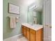 This charming bathroom offers a spacious vanity and a well-lit mirror, plus neutral decor at 4130 Town Center Rd, Harrisburg, NC 28075