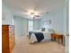 This cozy bedroom features a ceiling fan and carpet and is warmly decorated at 4130 Town Center Rd, Harrisburg, NC 28075