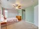 Bedroom with floral wallpaper accent wall at 4130 Town Center Rd, Harrisburg, NC 28075