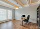 Bonus room with tray ceiling and modern fixtures at 4130 Town Center Rd, Harrisburg, NC 28075