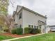 Well-maintained home featuring lush landscaping, healthy lawn and a covered entryway at 4130 Town Center Rd, Harrisburg, NC 28075