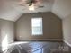 A bedroom with natural light, a ceiling fan, and space to make it your own at 5126 Rocky River Crossing Rd, Harrisburg, NC 28075
