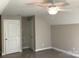 A spacious bedroom with neutral walls and a ceiling fan, awaiting your personal touch at 5126 Rocky River Crossing Rd, Harrisburg, NC 28075