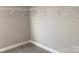 Walk-in closet showing wire shelving and neutral walls, creating a clutter-free space at 5126 Rocky River Crossing Rd, Harrisburg, NC 28075
