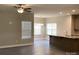 Spacious living space with great natural light, wood flooring, and kitchen access at 5126 Rocky River Crossing Rd, Harrisburg, NC 28075