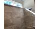 Tiled shower showcasing a modern showerhead and tile-work, enhancing the bathroom's aesthetic at 5126 Rocky River Crossing Rd, Harrisburg, NC 28075