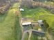 Overhead shot capturing various buildings, lush greenery, and a well-maintained yard on the property at 5373 Nc Hwy 16 N Hwy, Taylorsville, NC 28681