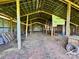 Spacious barn interior with exposed beams, offering versatile space for storage or conversion at 5373 Nc Hwy 16 N Hwy, Taylorsville, NC 28681