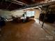 Finished basement with exposed ductwork, a wood burning stove and walk-out access to the yard at 5373 Nc Hwy 16 N Hwy, Taylorsville, NC 28681