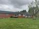 Charming brick home featuring a well-maintained lawn and inviting front porch at 5373 Nc Hwy 16 N Hwy, Taylorsville, NC 28681