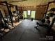 Spacious home gym boasts ample workout equipment and a view of the outdoors at 5373 Nc Hwy 16 N Hwy, Taylorsville, NC 28681
