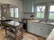 Bright kitchen featuring shaker cabinets, stainless appliances, butcher block countertop, and abundant natural light at 5373 Nc Hwy 16 N Hwy, Taylorsville, NC 28681
