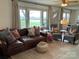 Bright living room featuring hardwood floors, ample seating, large windows and abundant natural light at 5373 Nc Hwy 16 N Hwy, Taylorsville, NC 28681