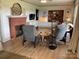 Cozy living room featuring a brick fireplace, hardwood floors and comfortable seating at 5373 Nc Hwy 16 N Hwy, Taylorsville, NC 28681