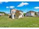 Spacious backyard featuring a lush green lawn, patio area, and beautifully landscaped surroundings at 6115 The Meadows Ln, Harrisburg, NC 28075