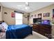 Bedroom featuring a bed, ceiling fan, and personal decor at 6115 The Meadows Ln, Harrisburg, NC 28075