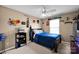 Bedroom with bed, ceiling fan and decorative sports decor at 6115 The Meadows Ln, Harrisburg, NC 28075