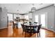Open floor plan includes updated dining area and kitchen with granite countertops at 6115 The Meadows Ln, Harrisburg, NC 28075