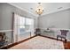 Elegant dining room with hardwood floors, bright natural light, and stylish decor at 6115 The Meadows Ln, Harrisburg, NC 28075