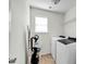 Bright laundry room with modern appliances, convenient for all laundry needs at 6115 The Meadows Ln, Harrisburg, NC 28075