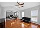 Bright living room with hardwood floors, high ceilings, and lots of natural light at 6115 The Meadows Ln, Harrisburg, NC 28075
