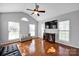 Bright living room with high ceilings, large windows, and hardwood floors at 6115 The Meadows Ln, Harrisburg, NC 28075