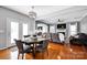 Open-concept living space features hardwood floors, fireplace, and plenty of natural light at 6115 The Meadows Ln, Harrisburg, NC 28075