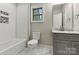 Bathroom featuring subway tile and a gray vanity at 6654 Maple Spring Ct, Denver, NC 28037