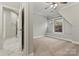 Bedroom with carpet and a door to an en-suite bathroom at 6654 Maple Spring Ct, Denver, NC 28037