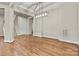 Dining area featuring hardwood floors and a modern light fixture at 6654 Maple Spring Ct, Denver, NC 28037