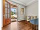 Foyer with gleaming hardwood floors, natural light, and a view of the landscaped front yard at 6654 Maple Spring Ct, Denver, NC 28037