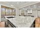 Gourmet kitchen island featuring a stainless steel sink and view to the open concept living space at 6654 Maple Spring Ct, Denver, NC 28037