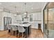 Modern kitchen with stainless steel appliances, an island with seating, and white cabinetry at 6654 Maple Spring Ct, Denver, NC 28037
