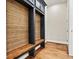 Mudroom area featuring custom built-in storage and wood accents at 6654 Maple Spring Ct, Denver, NC 28037