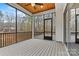 Covered back porch featuring an outdoor space, wood ceiling, fan and view at 6654 Maple Spring Ct, Denver, NC 28037