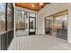 Spacious screened-in patio with ceiling fan, exterior door and view to the yard at 6654 Maple Spring Ct, Denver, NC 28037