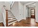 Staircase with wooden banister and hardwood treads and in-stair lights at 6654 Maple Spring Ct, Denver, NC 28037