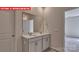 Bathroom featuring a double sink vanity with a large mirror at 7330 Stonehouse Dr, Gastonia, NC 28056