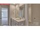 Double sink bathroom vanity with gray cabinets and modern fixtures at 7330 Stonehouse Dr, Gastonia, NC 28056