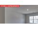 Bright bedroom with neutral carpet and a large window at 7330 Stonehouse Dr, Gastonia, NC 28056