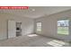 Bright bedroom with neutral walls and carpet, featuring natural light from two windows at 7330 Stonehouse Dr, Gastonia, NC 28056