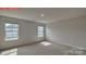 Bedroom with plush carpeting and natural light from two windows at 7330 Stonehouse Dr, Gastonia, NC 28056